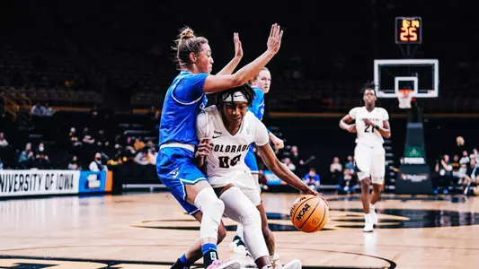 Sherrod driving to the basket