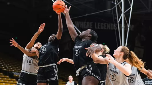 Bri McLeod and Aaronette Vonleh battle for a rebound