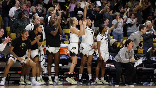 CU bench celebrates vs Oklahoma State