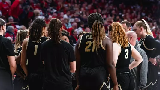Team huddle at Arizona
