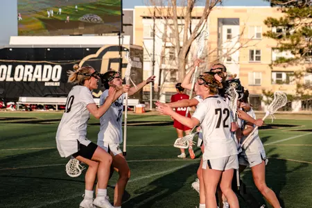 Team cheers after defeating Stanford