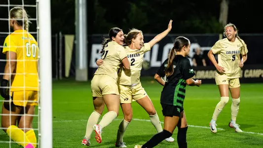 Ava Priest and Sami Fisher celebrate a goal