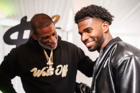 Shedeur Sanders and Coach Prime