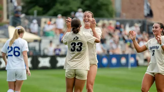 Jace Holley and Reagan Kotschau celebrate vs Air Force