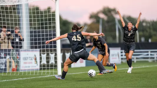 Hope Leyba scores with Jace Holley celebrating in the background