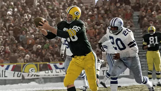 Boyd Dowler catches a 43-yard touchdown from Bart Starr in the 1967 NFL Championship Game, dubbed the "Ice Bowl." Dowler caught two touchdowns in this game, the coldest game in NFL history (-13 F with a -48 F wind chill).