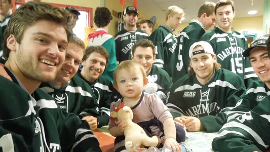 Men's Hockey Visits CHaD with Toys Donated by Fans