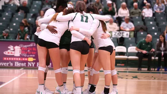Women's Volleyball huddle during cornell match