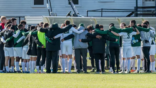 Huddle men's soccer action versus Cornell