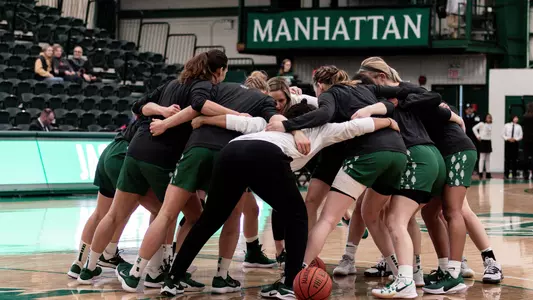 Huddle women's basketball action at Manhattan
