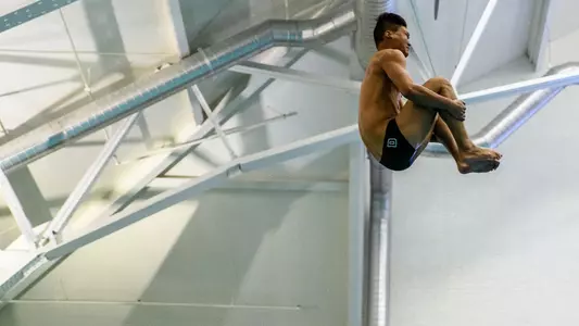 Jonathan Hu men's swimming and diving versus Bates