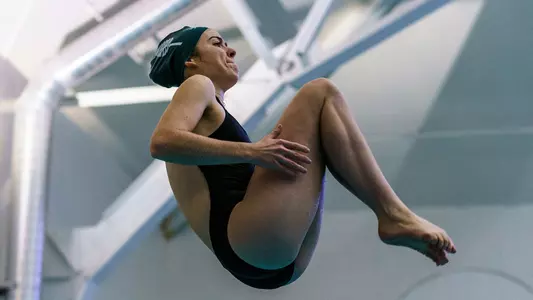 Cypress Toomey coaching swim and dive teams