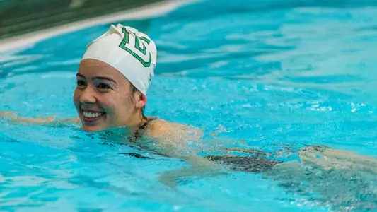 Cypress Toomey coaching swim and dive teams