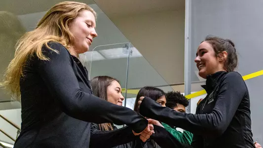 Olivia Gish and Claire Aube fistbump