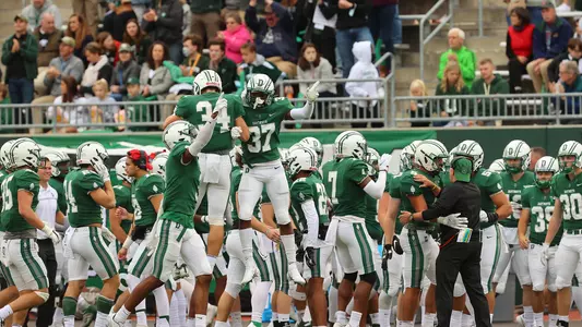 Arello and Raye chestbump football action versus Yale