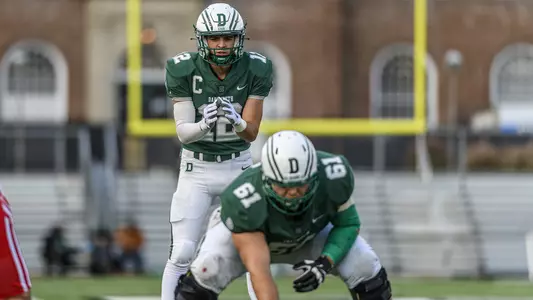 Derek Kyler ready for the snap from Evan Hecimovich vs. Cornell, Nov. 13, 2021