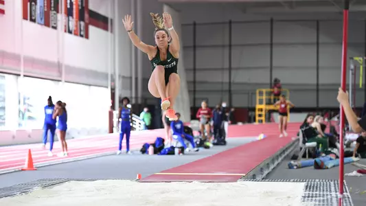 Bridget McNally jumping at Harvard track meet