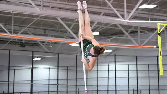 Maya Grudman vaulting at Harvard track meet