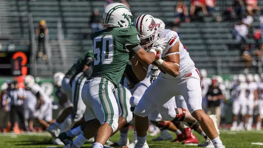 Trevon Erickson football action versus Sacred Heart