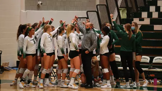 Team Huddle volleyball action versus Harvard