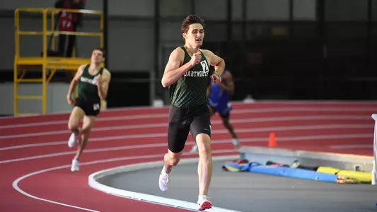 DJ Matusz men's track competing against Harvard