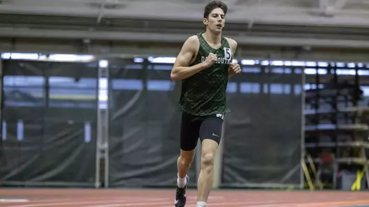 Ethan Hughes men's track action in Leverone Fieldhouse