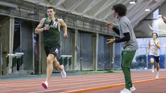 Jason Norris men's track action in Leverone Fieldhouse