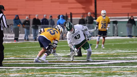 TJ Bryan men's lacrosse action versus Merrimack