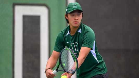 Logan Chang men's tennis action versus Brown