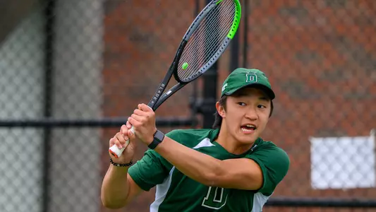 Logan Chang men's tennis action versus Brown
