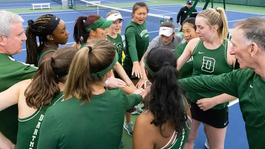 Team huddle competes against Ivy Rival Harvard