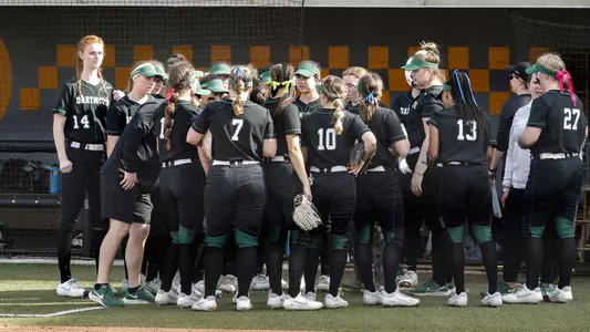 Huddle softball action versus Tennessee