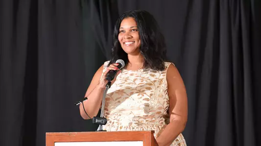 Tiffani Sykes speaks at the 2021-22 Celebration of Excellence