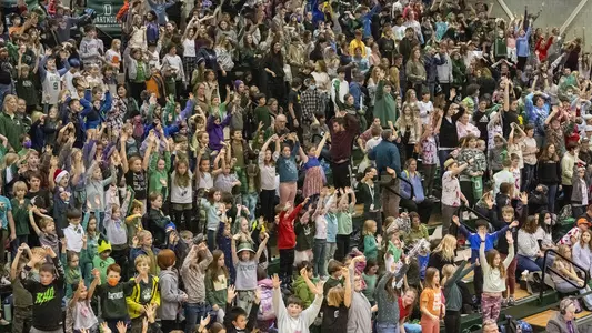 Large crowd women's basketball action youth day versus Drexel