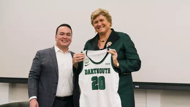 Mike Harrity with Gail Koziara Boudreaux '82 and her jersey