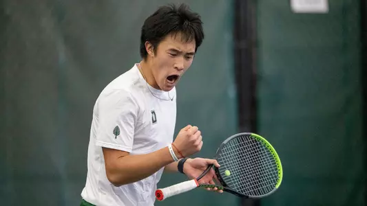 Logan Chang in tennis action versus Brown at ECAC Championship
