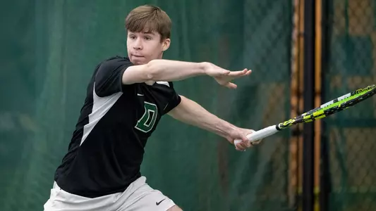 Miles Groom competes against Fordham in men's tennis