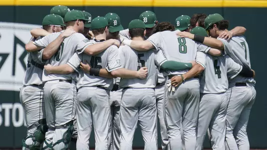 The team huddles before playing at No. 22 Miami, Feb. 26, 2023