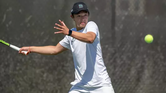 Logan Chang men's tennis action versus Yale