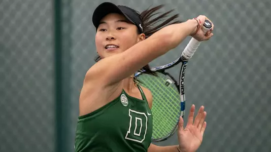 Emily Zhou women's tennis action versus Brown