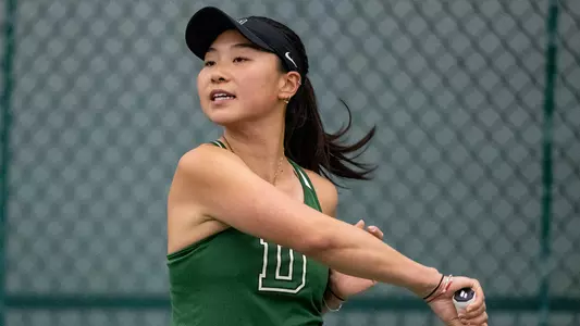 Emily Zhou women's tennis action versus Brown
