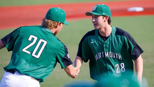Danny Will shakes hands with Luke Carpenter after tossing a scoreless inning against No. 11 Boston College, April 12, 2023