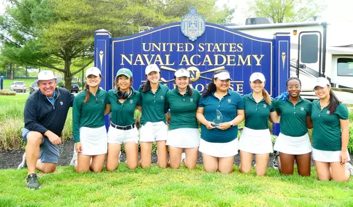 The Dartmouth women's golf team poses in front of the Naval Academy sign after winning the Navy Invitational, April 16, 2023