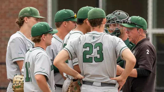 Bob Whalen confers with the team on the mound in the game against Yale, April 16, 2023