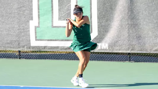 Wong plays tennis outside