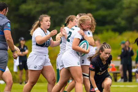 Walker celebrates a try with teammates
