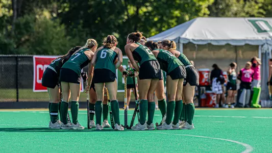 Field Hockey huddle before corner