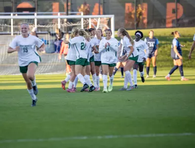 Women's soccer celebrating after goal
