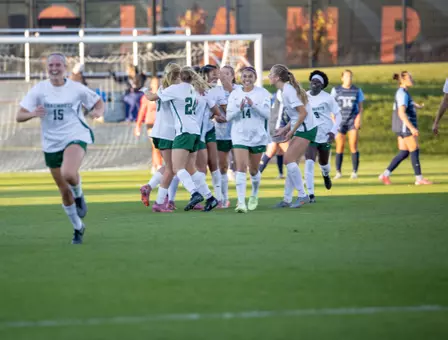 Women's soccer celebrating after goal