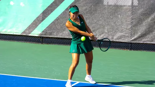 Lauren Han hits ball at home